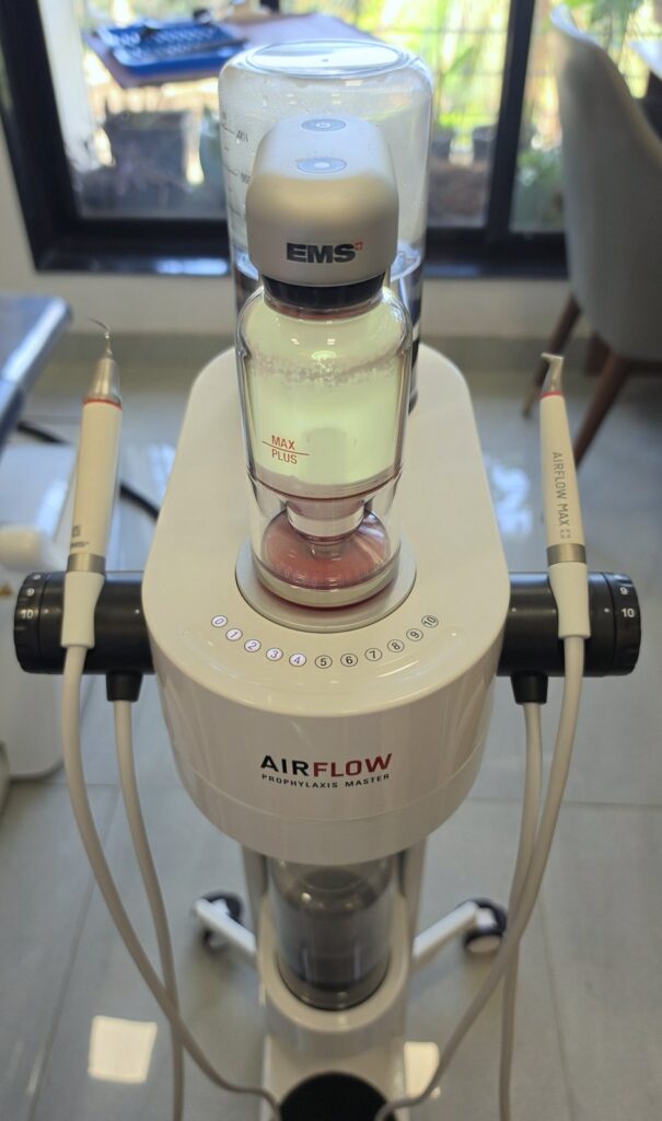 EMS Guided Biofilm Therapy (GBT) machine used for gentle, minimally invasive professional teeth cleaning at Embrace Orthodontics in Mumbai.